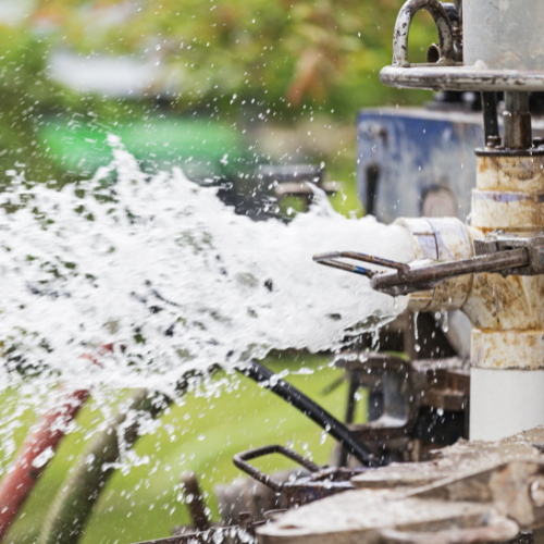 a tap that is splashing water to represent the hydrochemistry and water quality analysis service